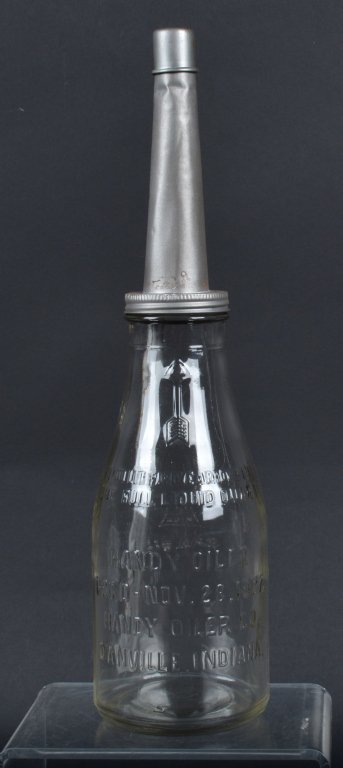 1922 HANDY OILER MOTOR OIUL BOTTLE AND SPOUT: Nice all original with spout and top. From Danville, Indiana dated 1922. Glass jar has no cracks. 15" tall. Excellent