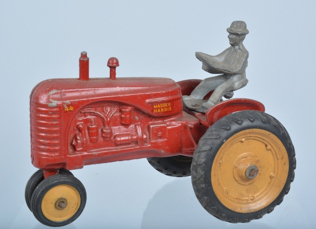 1950's Cast Metal Massey Harris 44 Tractor: Very nice vintage tractor measuring 7" long with driver. Minor wear. Very Good-Excellent