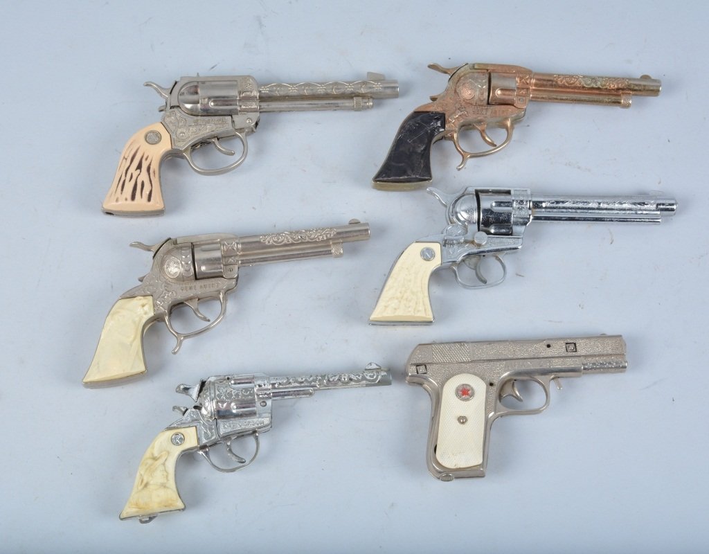 Lot of 6 VINTAGE CAP GUNS: Includes Gene Autry, Gold Gene Autry, Kit Carson, Restless Gun, and Stallion 38. All original. Largest measures 10" Very Good-Excellent