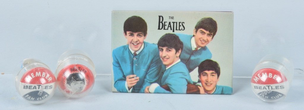 BEATLES MIRROR & GUMBALL BUTTON CHARMS: Original pocket mirror dated 1964 plus 3 Gumball prize buttons and guitar charm. Mirror measures 3"x2" Excellent