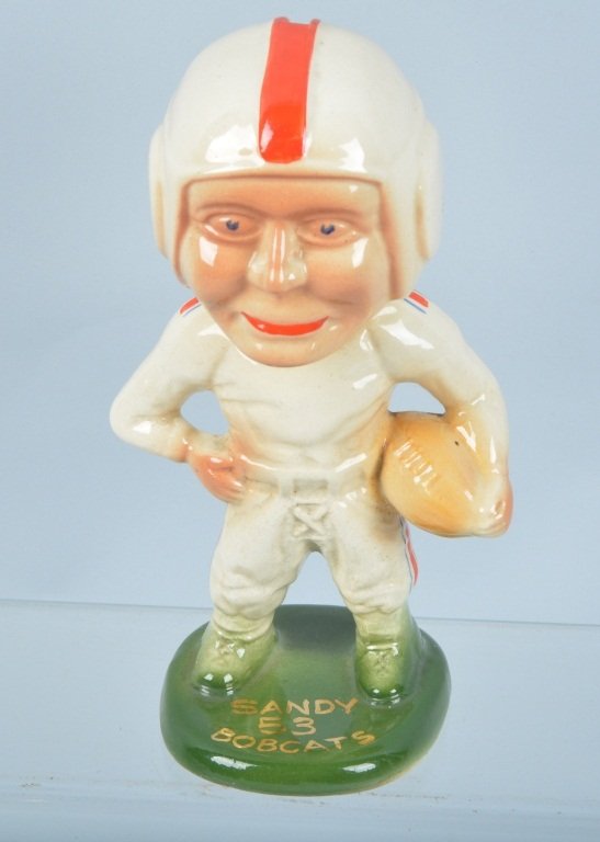 Porcelain FOOTBALL PLAYER BANK: Nice vintage bank says Sandy 53 Bobcats on front Asst. Coach on Back. Great Color and in excellent shape. 8" Excellent