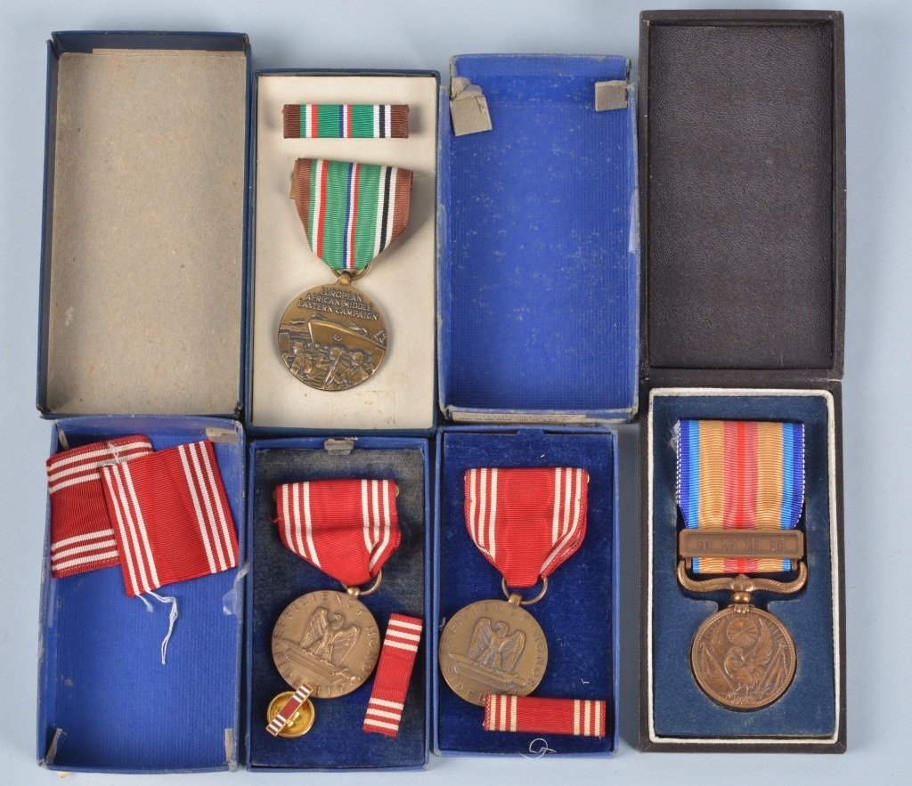 Lot of 4 Medals In Boxes US & Japan: Lot includes 2 WW2 period Good Conduct medals, 1979 Re-Issue of the European, African, Middle Eastern Campaign medal, along with a WW2 Japanese medal. Boxes show wear. Excellent