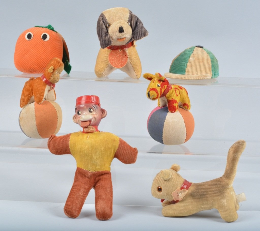 7 VINTAGE FIGURAL PLUS PIN CUSHION TAPE MEASURES: Nice lot of vintage figural plus pin cushion tape measures. Includes Monkey with celluloid face, Florida Orange, Dog, Monkey on Ball, and More. Very Good-Excellent