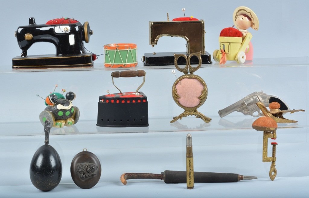 13 VINTAGE FIGURAL TAPE MEASURES & MORE: Includes 2 Sewing Machines, Drum, Wooden Lady with Wagon, Gun, Iron, and More. Very Good-Excellent