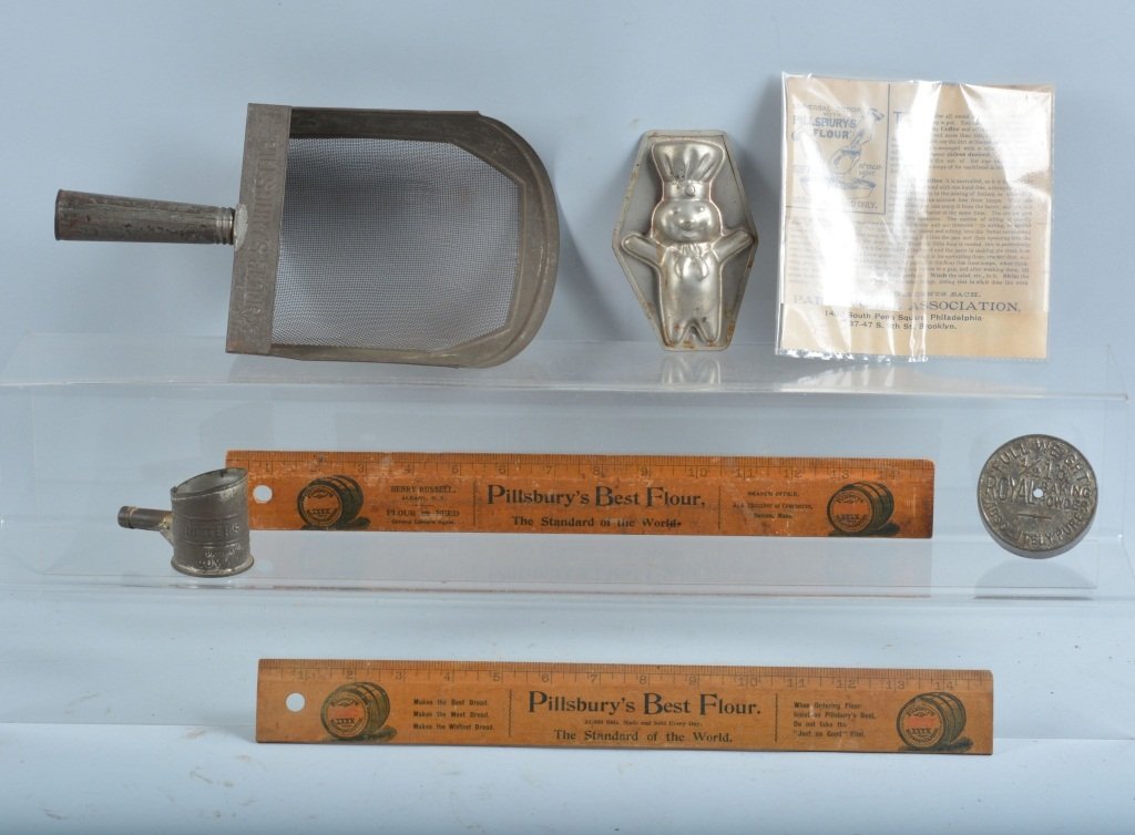 Pillsbury Advertising Items & More: Lot includes 2 vintage rulers, a Pillsbury sifting scoop, Doughboy candy mold, miniature Hunter sifter and Royal tin top. Good-Very Good