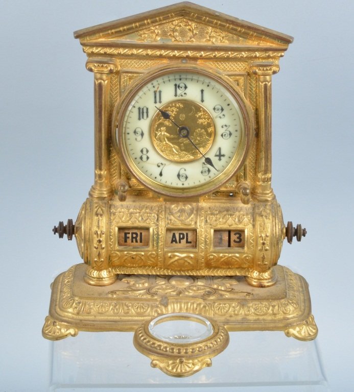 Victorian Brass Desk Calendar Clock: Measures 9" by 7". Has very nice cast details. Clocks winds and holds but is not working correctly. Ink well glass is a old replacement. Excellent