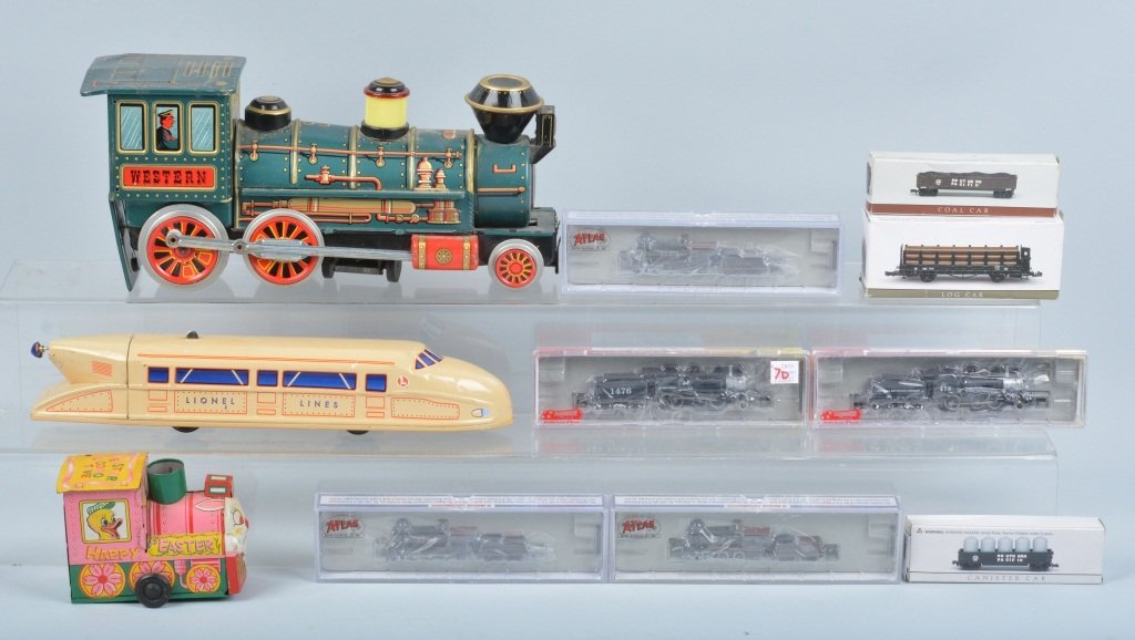 Lot of TOY TRAINS: Large lot includes windup Easter Train, battery op Western Train, Lionel Streamliner Train, N-Scale Engines and cars. Many with Boxes. Largest measures 12" Very Good-Near Mint
