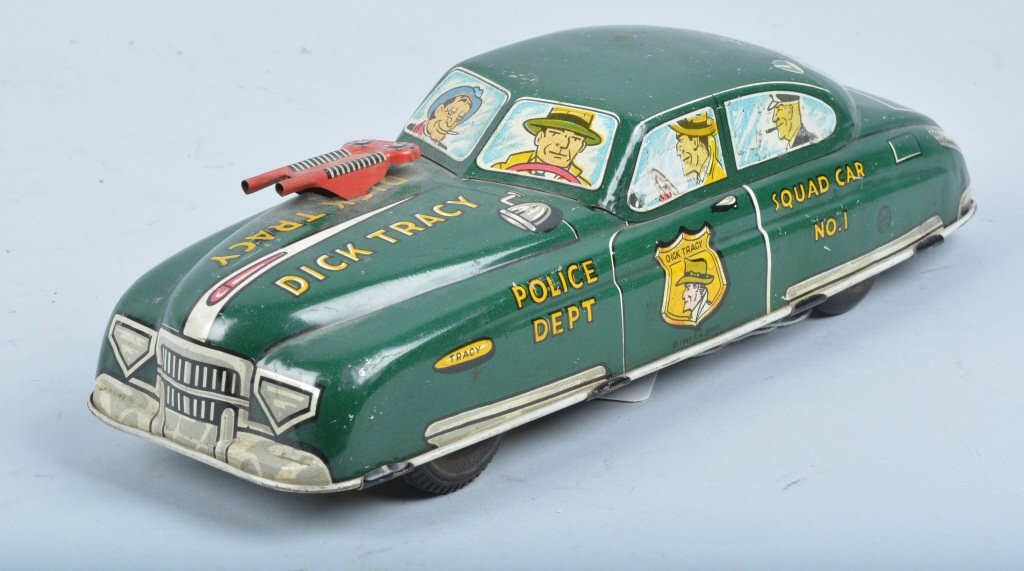 MARX Tin Friction DICK TRACY SQUAD CAR: Marx tin friction Dick Tracy Squad Car. Large versions with unusual gun on hood. Nice colors and graphics. Works. 11" Excellent