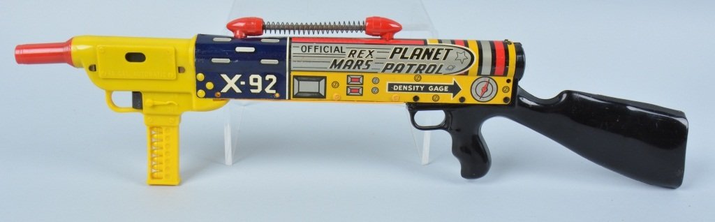 MARX Tin Windup REX MARS PLANET PATROL RIFLE: Scarce Marx tin and plastic windup Rex Mars Planet Patrol Space Rifle. This is a very hard to find version of this toy! Rifle has great colors and graphics. One tab on front is broken and windup not w