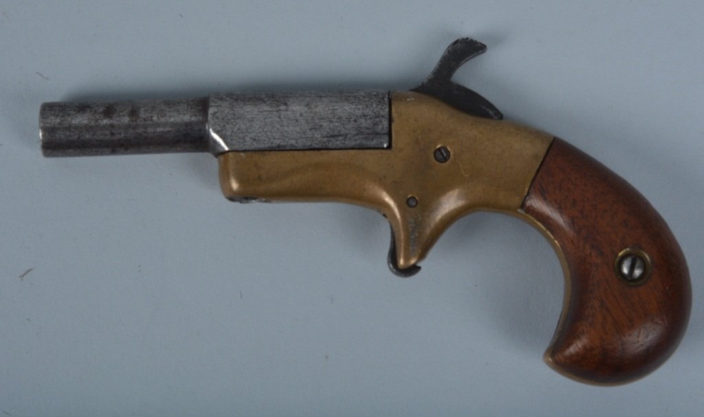 BRASS FRAME SINGLE SHOT .22 DERRINGER: Unmarked Brass Frame Single Shot Derringer .22 short. 2 1/2 swivel barrel. Very Good