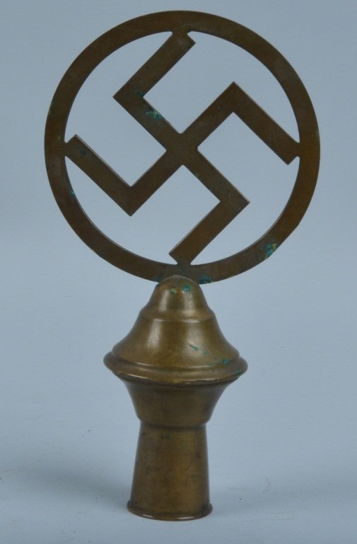 NAZI BRASS FLAG POLE TOPPER: Original Nazi brass flag pole topper. Very well made thin swastika in 4 1/2" circle. 8 1/2" overall. Excellent