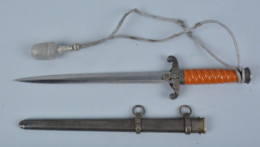 WWII NAZI ARMY OFFICER DAGGER BY CARL EICKHORN: Beautiful all original WWII Nazi Army Officer Dagger singed Eickhorn with the squirrel logo. Beautiful crisp blade. Nice orange celluloid handle is in beautiful shape. Handle has beautiful Nazi Eagle 