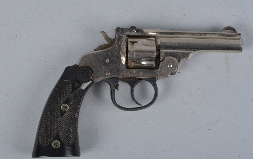 H & R NICKLE PLATED 32 S&W 5 SHOT REVOLVER: H & R Nickel Plated 32 S&W 5 Shot Revolver. This gun retains most of its original nickel finish. Finish has light spotting and some abrasions. Has original grips in excellent condition. Action in work