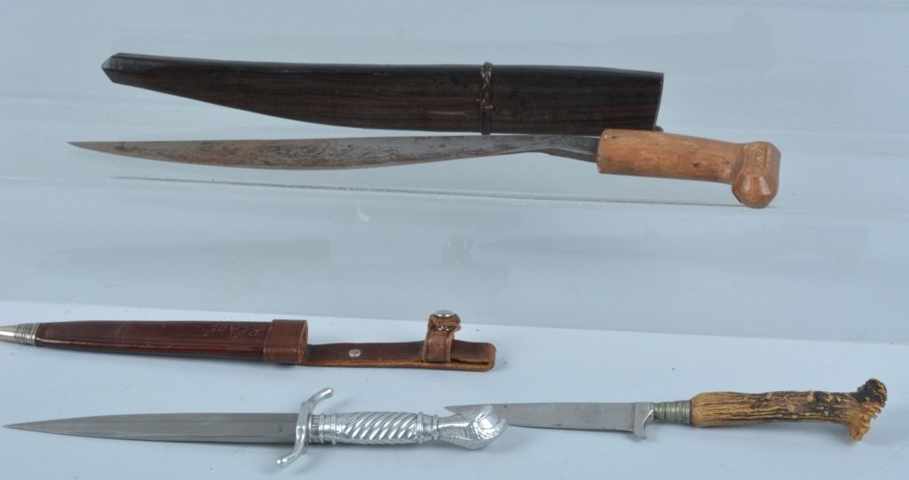 LOT OF 3 VINTAGE KNIVES: Nice lot with Phillipino knife, stag handle boot knife, and boot knife with cast metal handle marked Solingen Germany. Largest is 11 1/2", Excellent