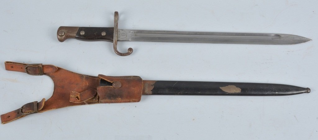 M1895 ARGENTINA MAUSER BAYONET & SCABBARD: Argentina bayonet, 18 13/4" bright blade, wood grip, light rust on guard, metal scabbard with wear, and leather frog. Excellent