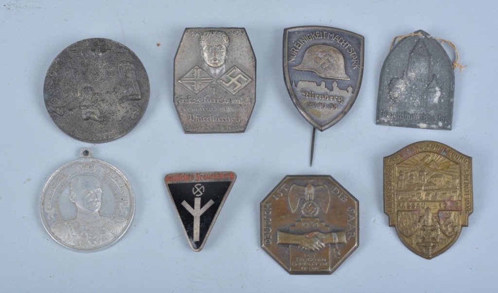 8- WWII GERMAN NAZI TINNIE BADGES: Nice lot of 8 WWII German Nazi Tinnie Badges. All different badges. Interesting badges with Nazi Eagles, Swastikas, Helmet, and more. Excellent