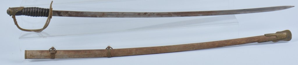 M1872 CAVALRY OFFICER'S SWORD: Cavalry officer's sword, 32" plain blade some staining, no makers mark. original washer, ornate brass guard with perfect leather grip with brass wire. Scabbard is dark with ornate mounts. Very Good
