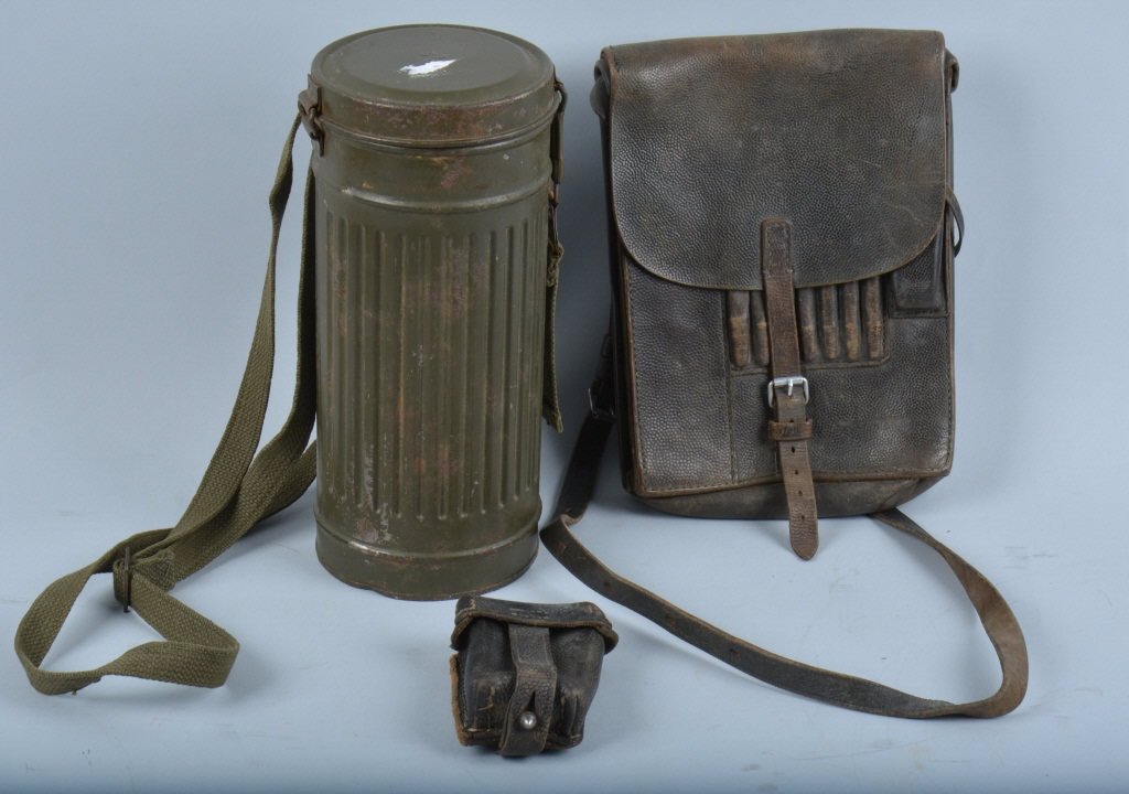 WWII GERMAN EQUIPMENT LOT: Equipment lot includes empty metal gas mask container, leather map case, and a Mauser M98 mag pouch. Very Good