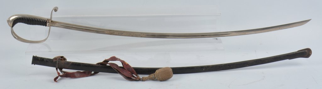 IMPERIAL GERMAN LIGHT CAVALRY SWORD: The blade is 32" unstop fuller blade. It has German motto engraved in center. Solingen proofs on blade. It has perfect ebony grip. Back Strap and guard in perfect condition. It retains original sword