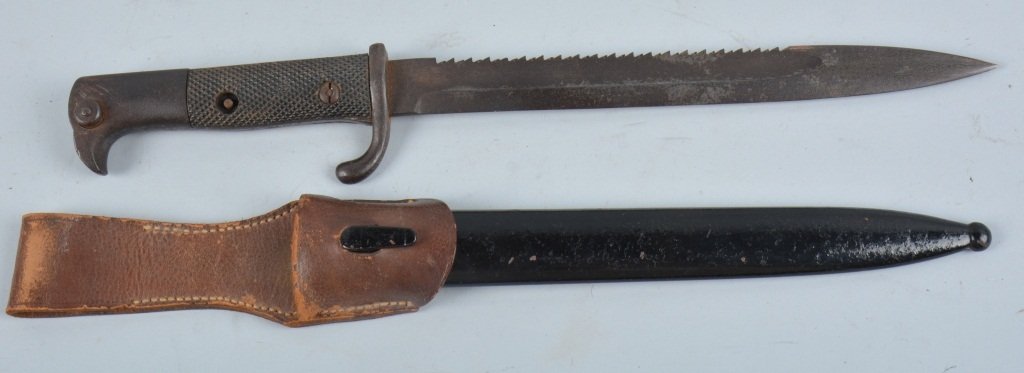 GERMAN POLICE DRESS BAYONET: The Saw Back Blade is 10". It has a dark blade. Checkered handle intact missing one washer and has dark metal. It has no pitting or rust will clean. "Rare Pig Skin frog intact" It has a perfect metal 