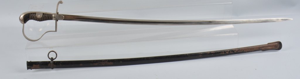 IMPERIAL GERMAN OFFICERS SWORD: 33" Single Fuller Mirror Blade marked Puma with puma logo. retains original washer. Ebony grip with perfect with twisted wire wrap. Reverse P Guard has light tarnish. Original scabbard has light wear.