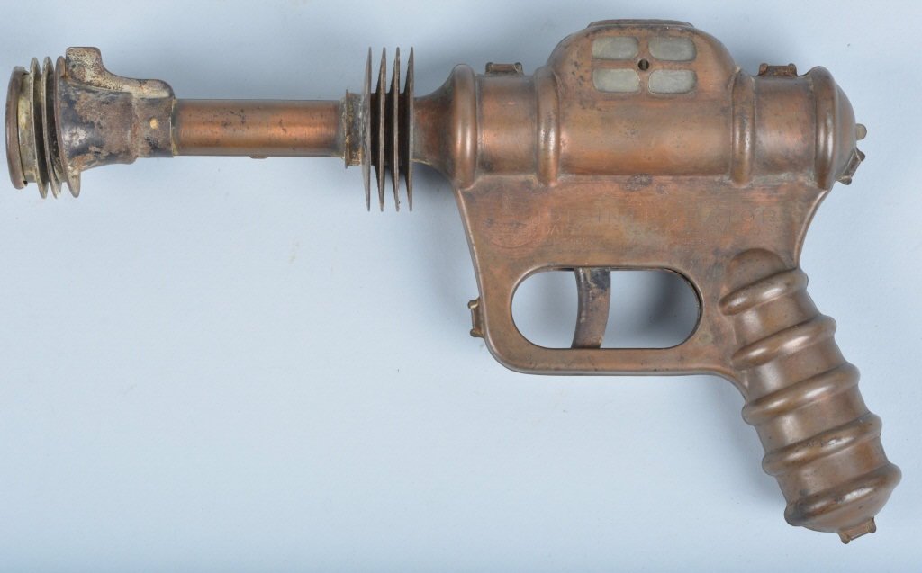 1940s DAISY BUCK ROGERS DISINTERGRATOR GUN: 1940s Original Daisy Buck Rogers Disintegrator Gun. All original with nice copper finish. Pop action still works. 10'" Excellent