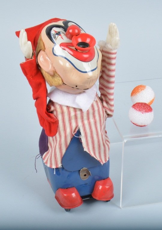 JAPAN TIN BALL BLOWING CLOWN, VINTAGE: nice mostly tin toy with great action. Comes with 2 styrofoam balls. Measures 11" high. Minor wear. Excellent