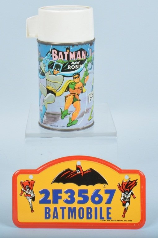 LOT OF 2 BATMAN ITEMS, THERMOS & LICENSE PLATE: 1966 Aladdin thermos is very good with wear. 1966 license plate has great graphics and is excellent. Very Good-Excellent