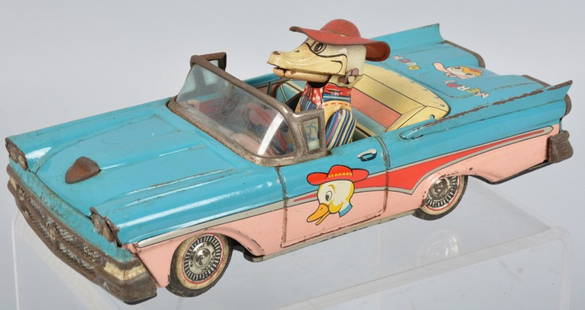 JAPAN Tin Friction MERRY DUCK CAR: Colorful Japan tin friction Merry Duck Car. Car looks like a 1950s Ford Convertible. Nice colors and graphics. Duck driver's beak moves and quacks as car rolls along. Friction works. 8" Very Good