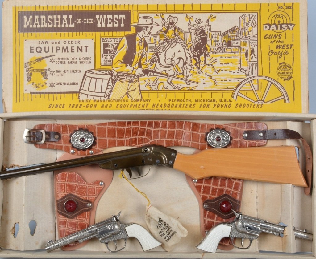 DAISY MARSHALL OF THE WEST GUN OUTFIT w/ BOX: Excellent Daisy Marshall of the West Gun Outfit. Great set includes Double Barrel Shot Gun, 2 Revolvers, and Leather Gun Belt. All never played with in original box. 24" Excellent-Near Mint
