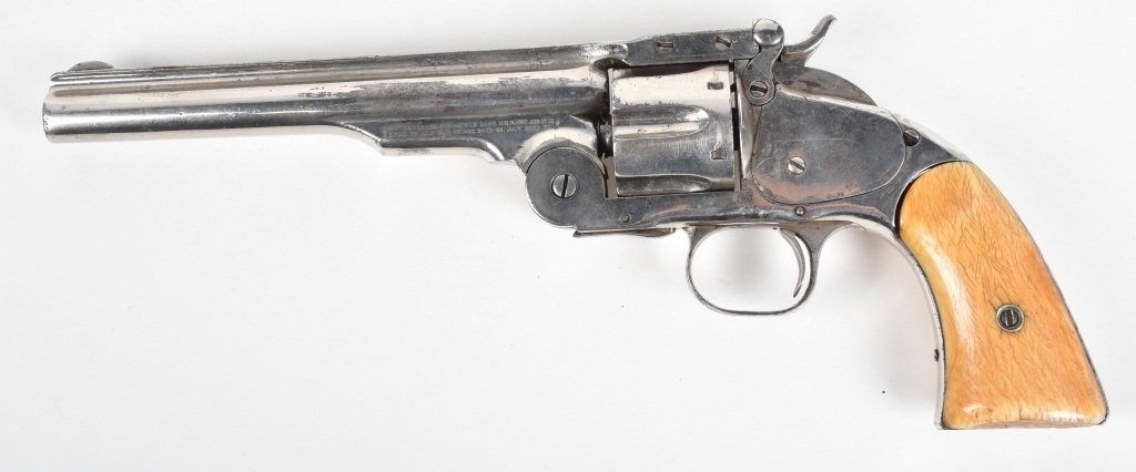 SMITH & WESSON SCHOFIELD, 44, REVOLVER: SN 7664, MFG 1870's, very good single action, good markings, appears to be old re-nickel, ivory grips have some crazing and small chipping at butt. Very Good