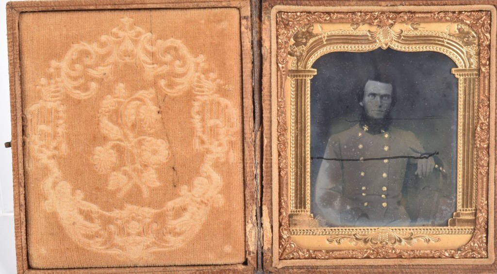CIVIL WAR 1/6 PLATE AMBROTYPE CONFEDERATE: Great ambrotype image of a Confederate officer, housed in a worn leather case. The clarity is very good, and there is a swipe across the plate. Some emulsion fading on edges. Very Good plus