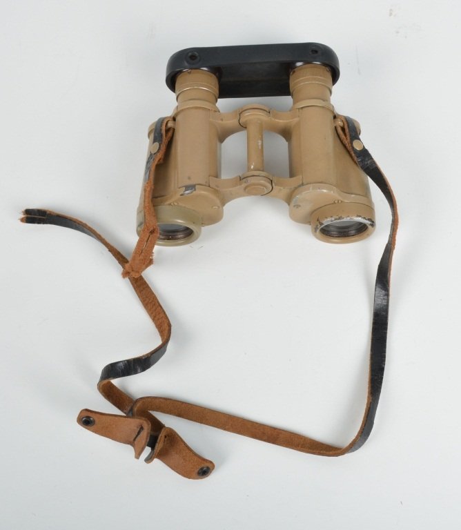 WW2 NAZI GERMAN AFRICA CORPS BINNOCULARS: German field glasses with desert camo, maker marked Dienstgias, 6 by 30 with excellent optics. Includes rubber eye glass cover. Leather strap has tear. Excellent