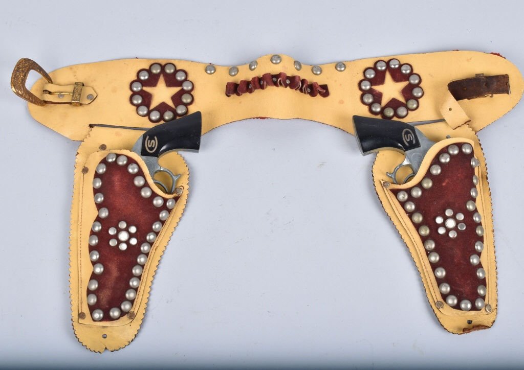 LEATHER HOLSTER WITH 2 CHEYENNE CAP GUNS: Nice leather studded holster with 2 Cheyenne Shooter cap guns. Excellent