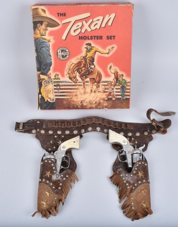 HALCO TEXAN HOLSTER SET and 2 CAP GUNS w/ BOX: Fancy leather holster with metal studs. With two 6 Shooter Cap Guns. Excellent