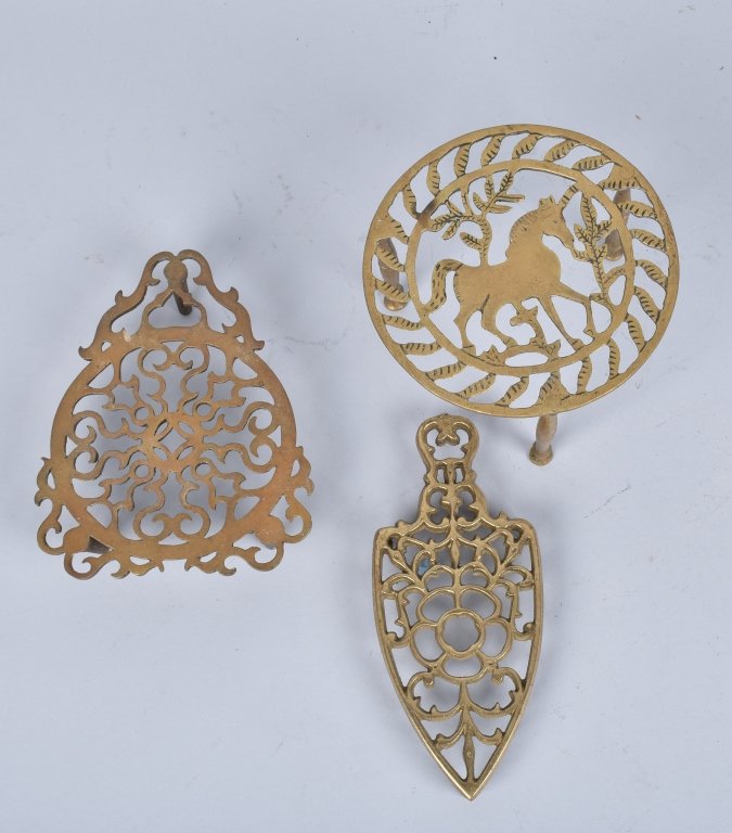 Lot of 3 BRASS TRIVETS, VINTAGE: Nice lot with 6" horse that 3 1/2" high, as well as 2 other nicely cast trivets. Very Good