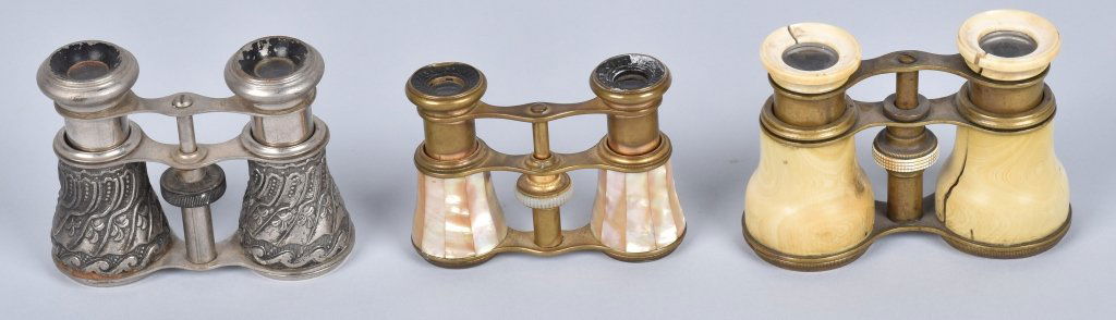 Lot of 3 OPERA GLASSES, VINTAGE: Lot includes silver pair mad In Occupied Japan, brass pair with mother of pearl made in Paris, and a brass pair with thick celluloid covering. This pair has 3 split sot the celluloid. Condition varies