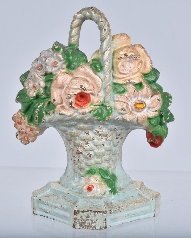 HUBLEY CAST IRON BASKET of FLOWERS DOORSTOP: measures 6" by 4 1/2". Has very nice original colors, and minor paint loss. Very Good