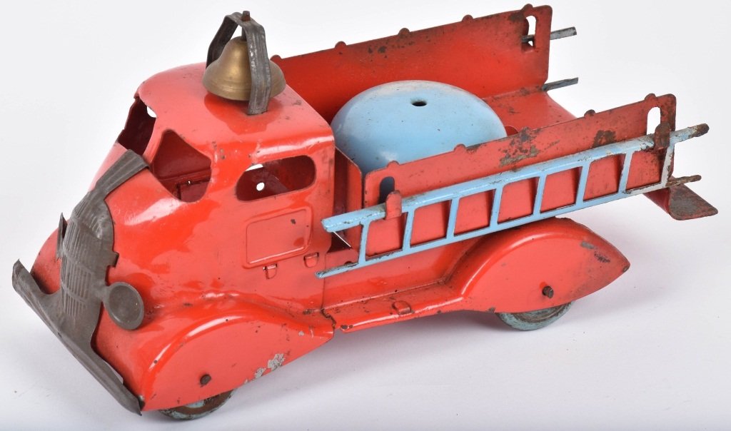 MARX BELL RINGER FIRE TRUCK: Very early and unusual Marx pressed steel fire truck that has bell in bed that rings as truck rolls alonr. All original with ladders and bell. 10" Very Good