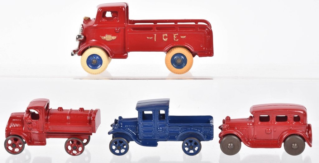 4- CAST IRON VEHICLES: Nice lot of 4 restored cast iron toys. Includes Ice Truck, Gas Truck, Pickup Truck, and Sedan. Largest measures 7" Excellent