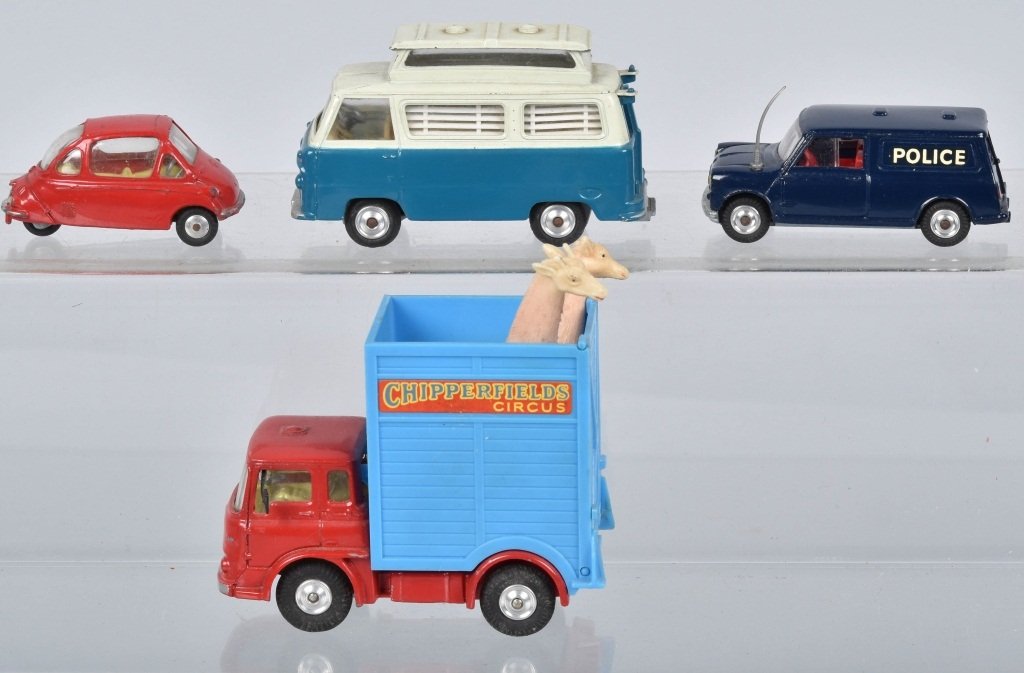 Lot of 4 CORGI VEHICLES: Includes Chipperfields Bedford Tractor Unit with Giraffs, Austin Mini Police Van with Dog, Heinkel, and Ford Thames Caravan. Excellent