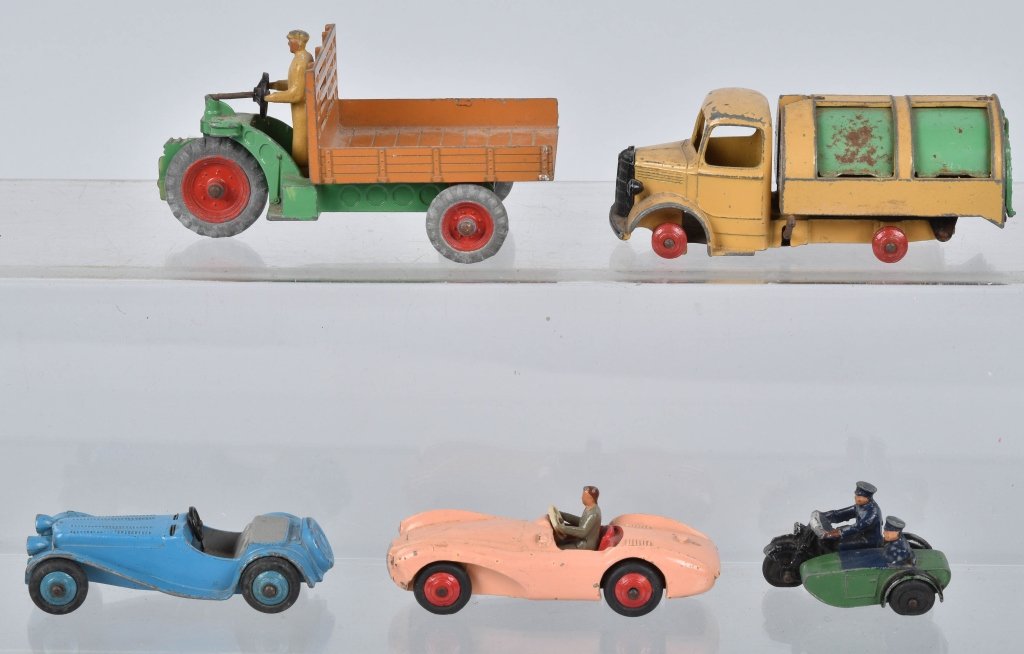 5- DINKY TOY VEHICLES: Includes Motocart, Austin Martin, Jaguar missing wind screen, Bedford Dust Cart missing tires, and Motorcycle with Side car. Very Good