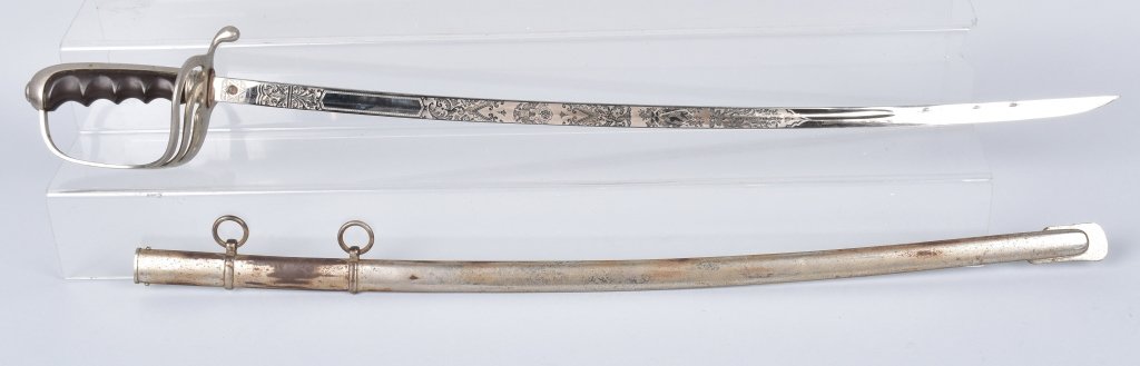 M1902 US OFFICERS SWORD, with ETCHED BLADE: 33" overall with a beautifully etched 28" blade. Blade is bright and is marked Trade Spartan Mark, N.S. Meyer New York Inc. Light wear on sword, scabbard has some spots of plating loss. Very Good-Exce