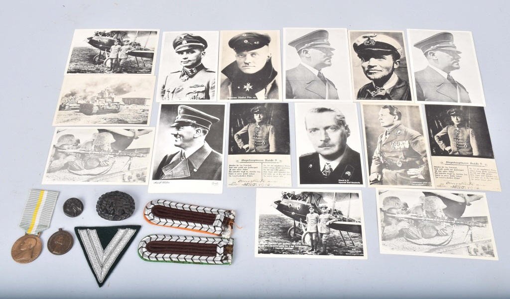 LOT OF GERMAN WW1 and WW2 ITEMS & MORE: Lot includes 15 photo postcards from WW1 and WW2, German shoulder boards, SS rank insignia, WW1 Belgian medal, WW2 era Pope Pius medal and more. Very Good-Excellent
