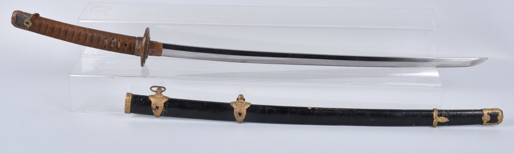 JAPANESE SWORD / KATANA SIGNED TANG: Katana is 33" overall with a 26" blade, tang is maker marked and menuki has family crest. Has Naval Kai Gunto Mounts. Dates from the 1600's. Blade is polished and has an edge crack 10 3/4" from the Ts