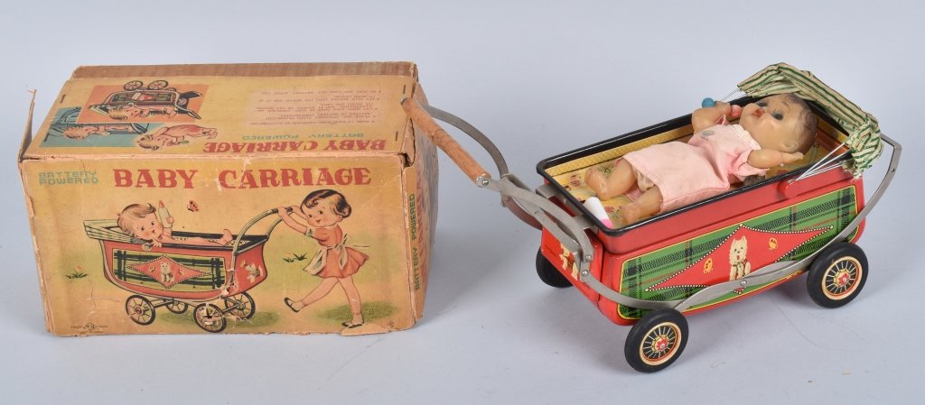 Boxed TN Battery Operated Baby Carriage: Working when tested, turns off with baby bottle. Boxed has wear and tears, toy shows playwear. VG-Fine