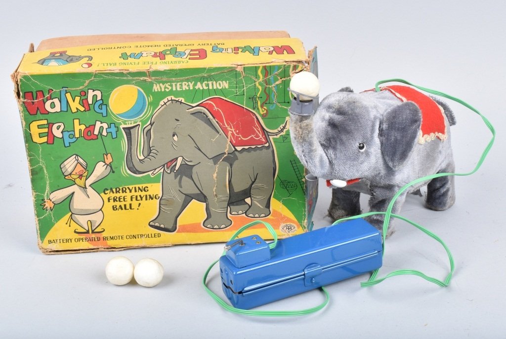 Battery Operated Walking Elephant by Masudaya: Boxed toy worked when tested, complete with balls and inserts. Box shows wear. 8 1/2" long, VF