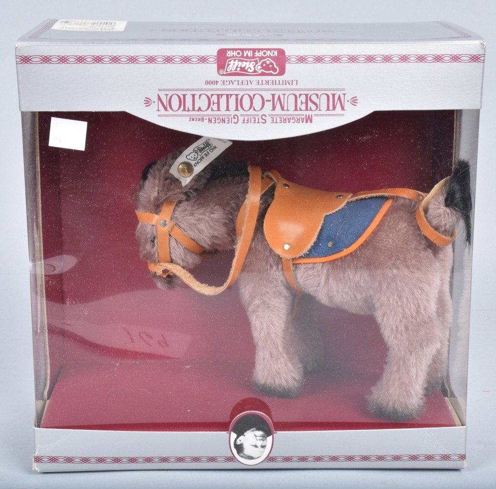 STEIFF MUSEUM MECHANICAL DONKEY 0126/20: Limited Edition of 4000. Replica of 1931 piece made in 1989. Has button and Flag. 7" With Box. Excellent