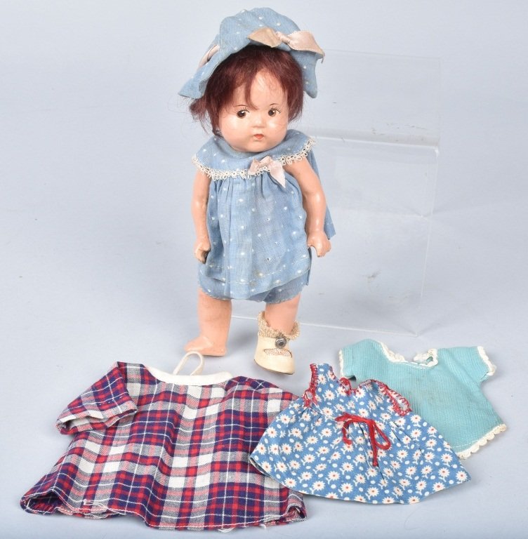 MADAME ALEXANDER 7" DIONNE QUINT DOLL: Walker body, possibly original outfit, missing sock and shoe. Comes with tagged jumper and two other clothing items. VG-EX