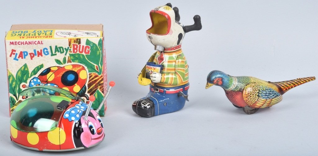 THREE TIN WINDUP TOYS: Kohler Pheasant, TPS Candy Loving Canine and a NMIB Lady Bug by Ohta, Japan. All toys working. Largest 5 1/2" tall. EX-NM